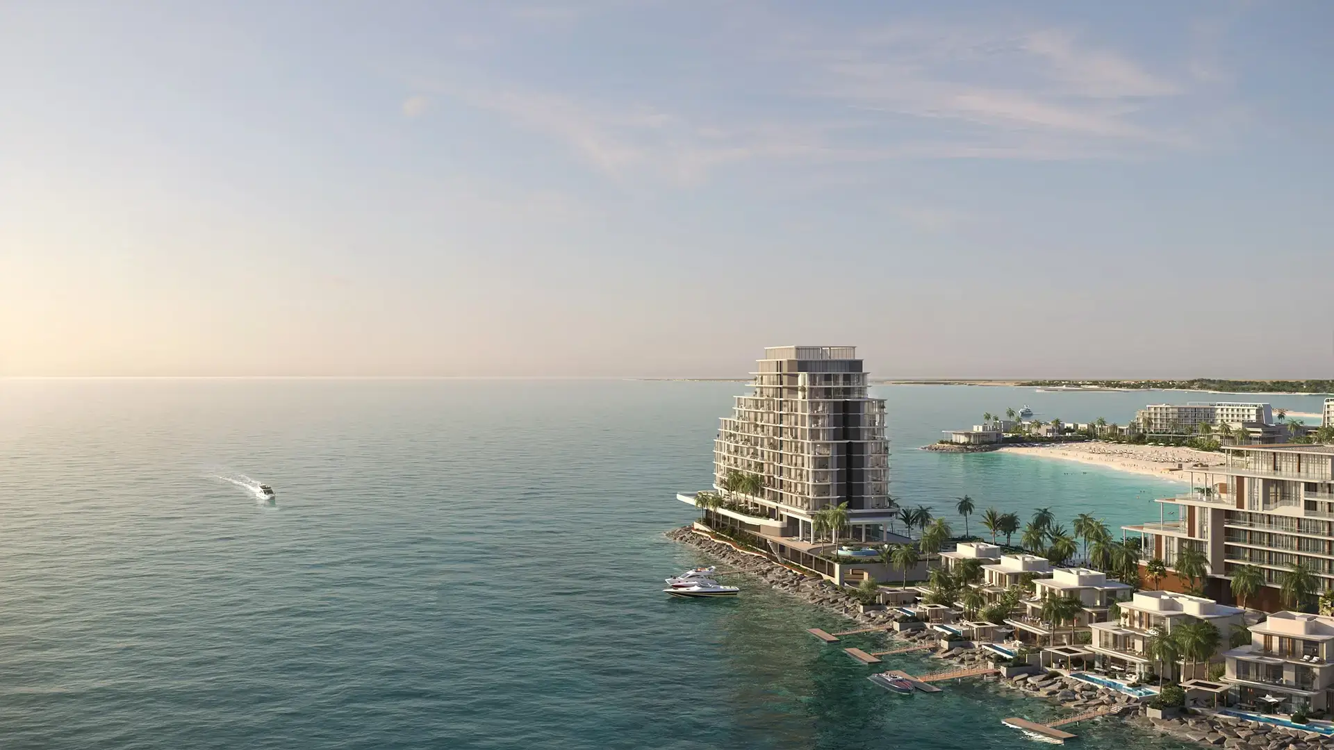 Anantara Residences – aerial view of a tower and beachfront villas on the coastline