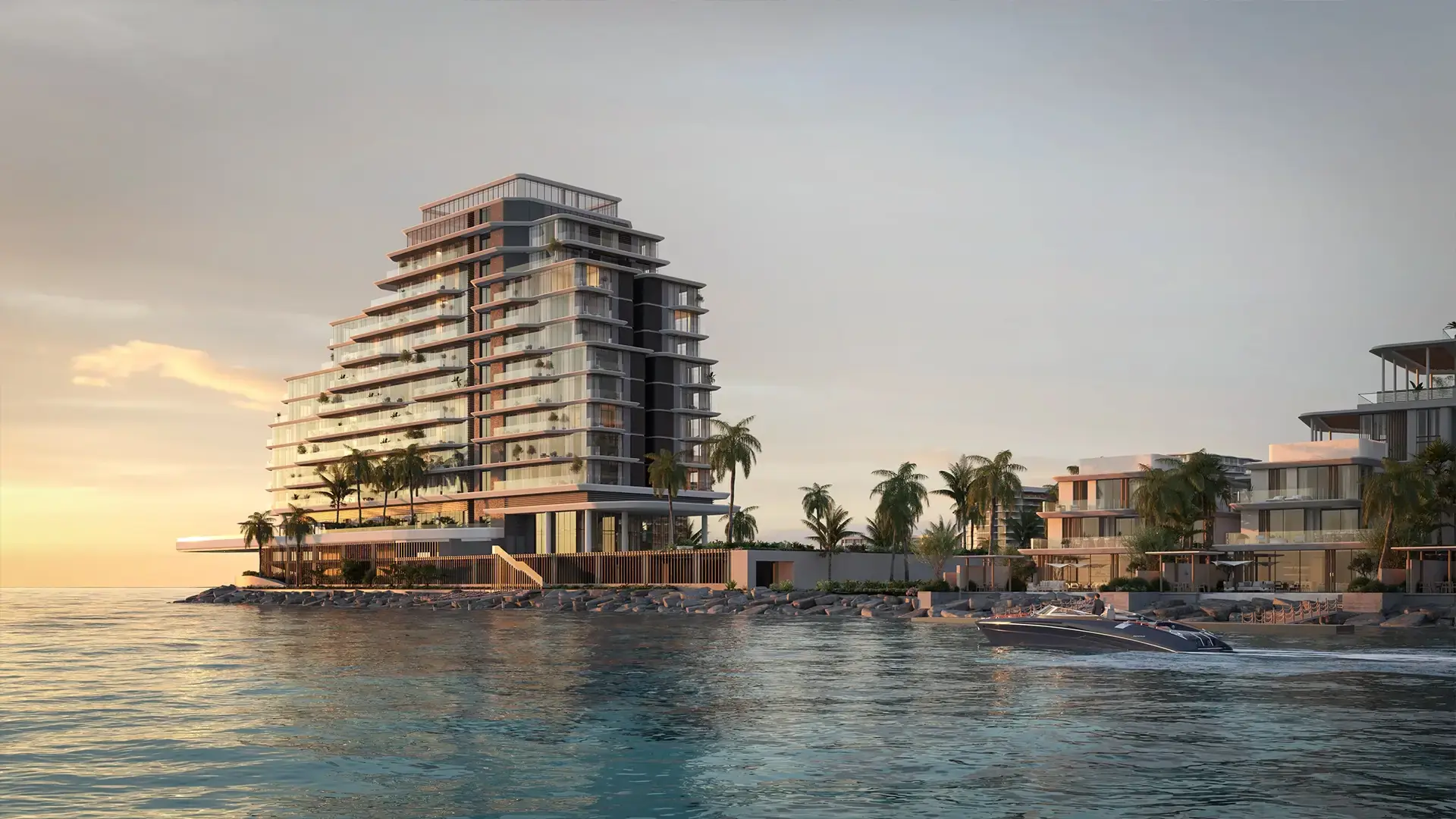 Anantara Residences – residential tower and waterfront villas at sunset with a boat