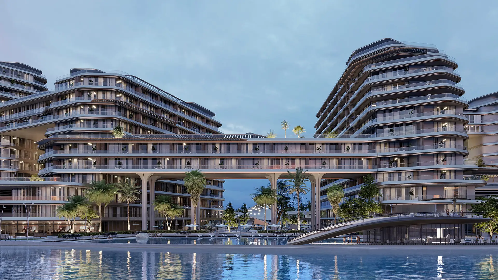 Quattro Del Mar – curved residential buildings and a connecting bridge reflected in the water