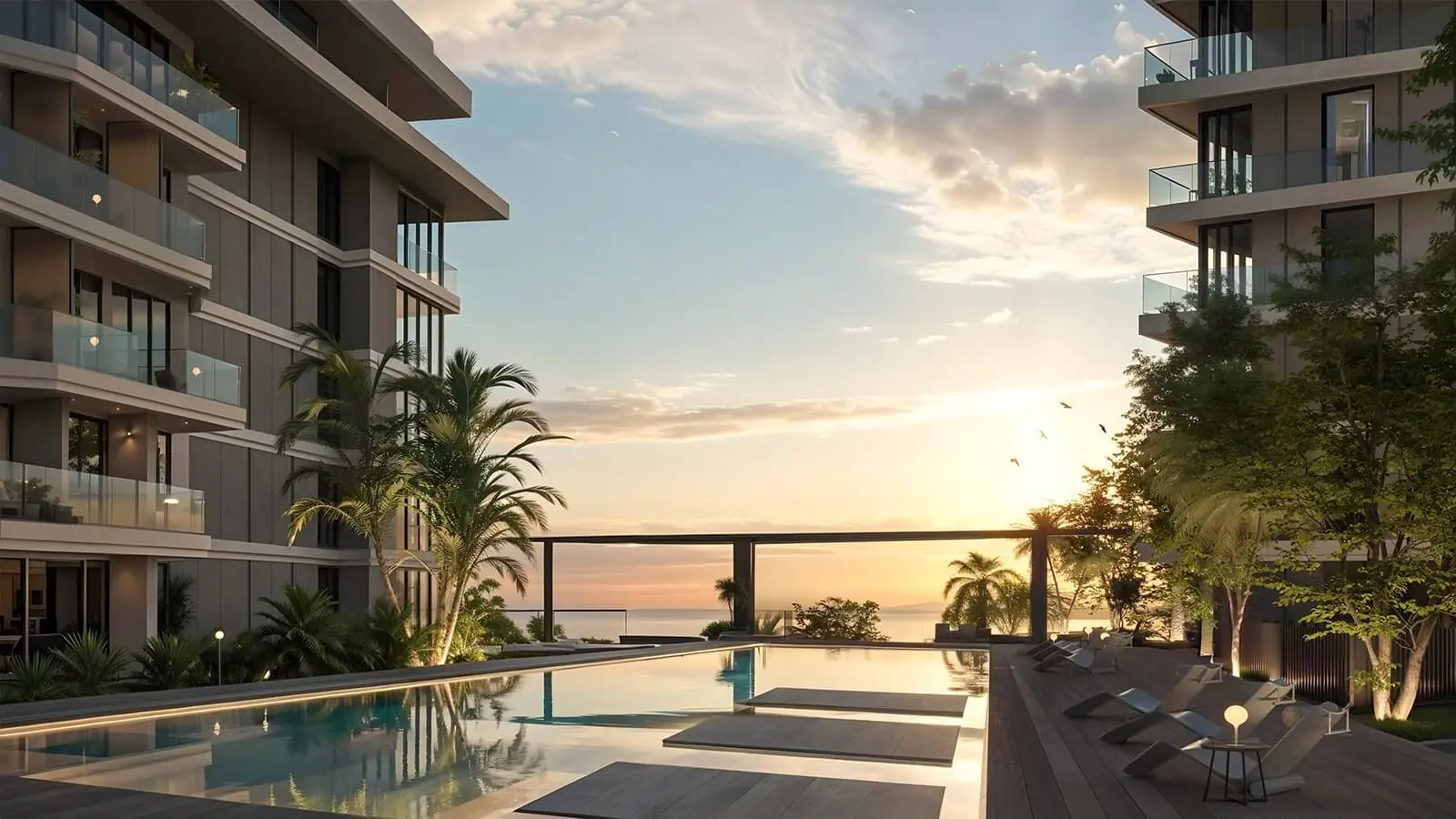 SKAI – pool deck between residential buildings overlooking the sea at sunset